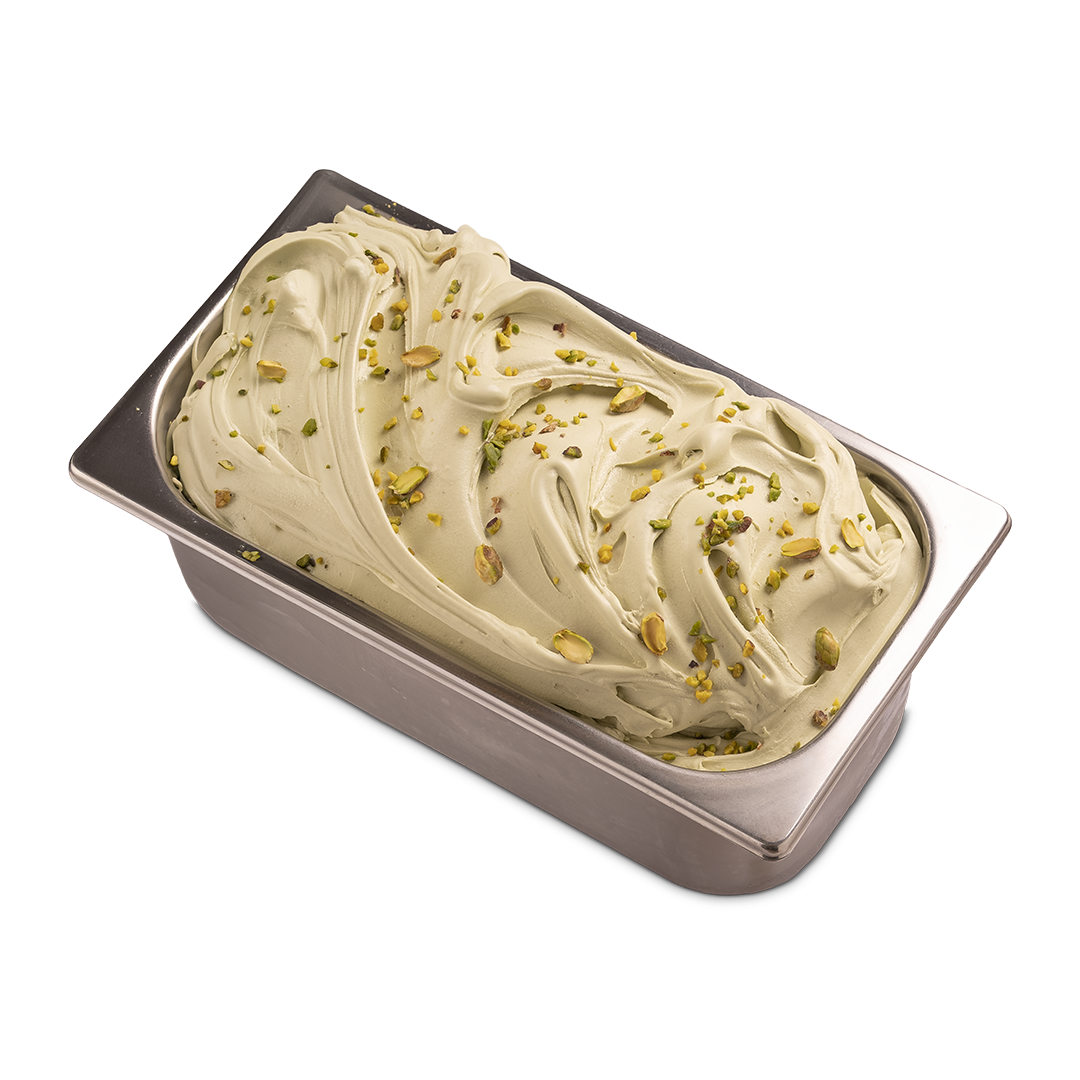 Rectangular metal gelato tub filled with swirled pistachio gelato topped with crushed pistachio nuts, on a white back...