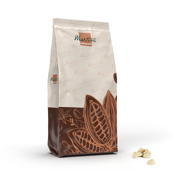 Sealed bag of Martini Cioccolato white chocolate chips with cocoa pod illustration, chips scattered beside it.
